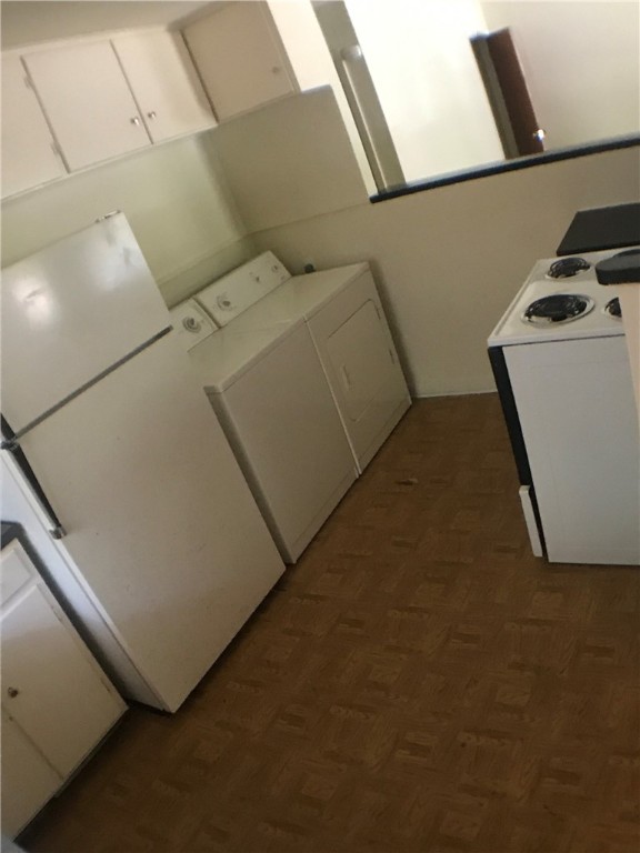 917 Keith Lane, Unit B Austin, TX 78705 - Photo 6 of 11 a utility room with dryer and washer