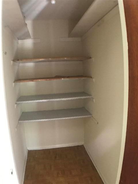 917 Keith Lane, Unit B Austin, TX 78705 - Photo 7 of 11 a view of walk in closet with empty racks