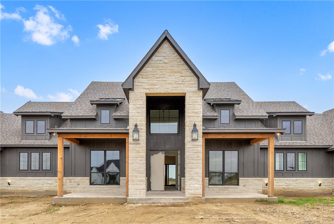 1141 Bluebonnet Ridge Drive Chappell Hill, TX 77426 - Photo 2 of 32 a front view of a house with a yard