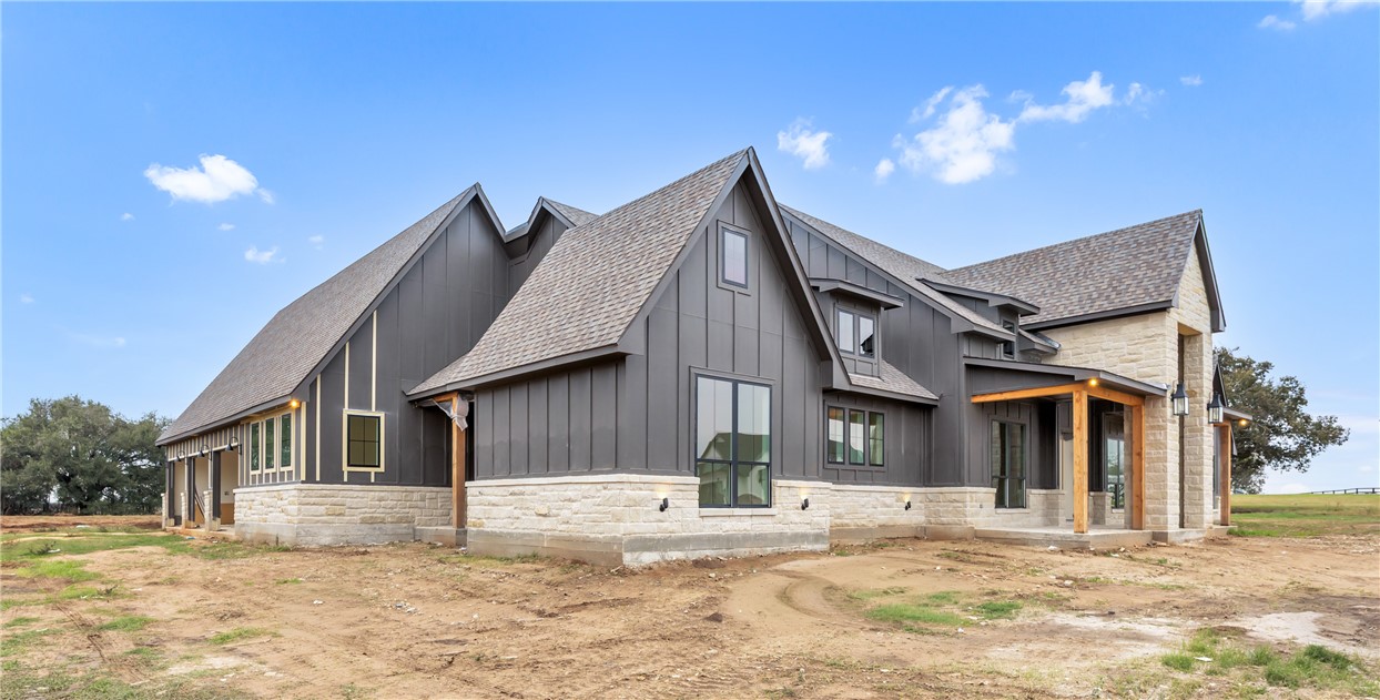 1141 Bluebonnet Ridge Drive Chappell Hill, TX 77426 - Photo 32 of 32 a front view of a house with a yard