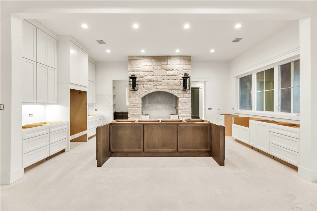 1141 Bluebonnet Ridge Drive Chappell Hill, TX 77426 - Photo 4 of 32 a living room with furniture and a fireplace