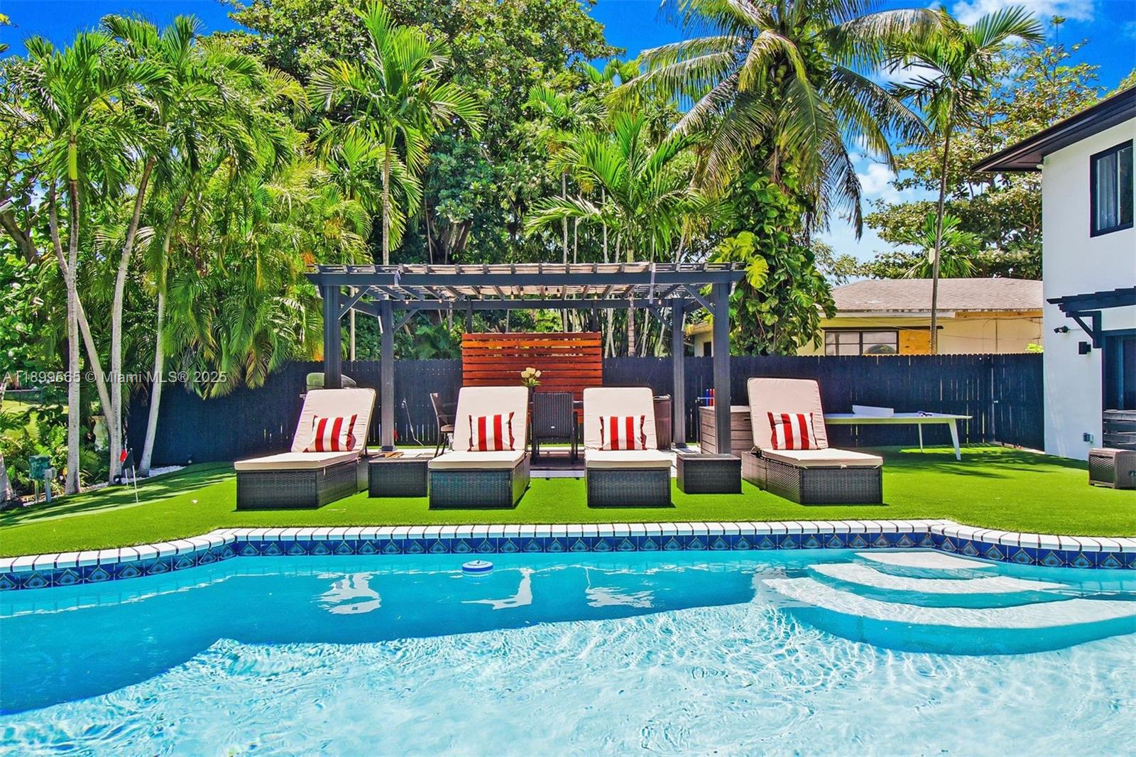 11975 West Biscayne Canal Road Miami, FL 33161 - Photo 11 of 58 a front view of house with yard