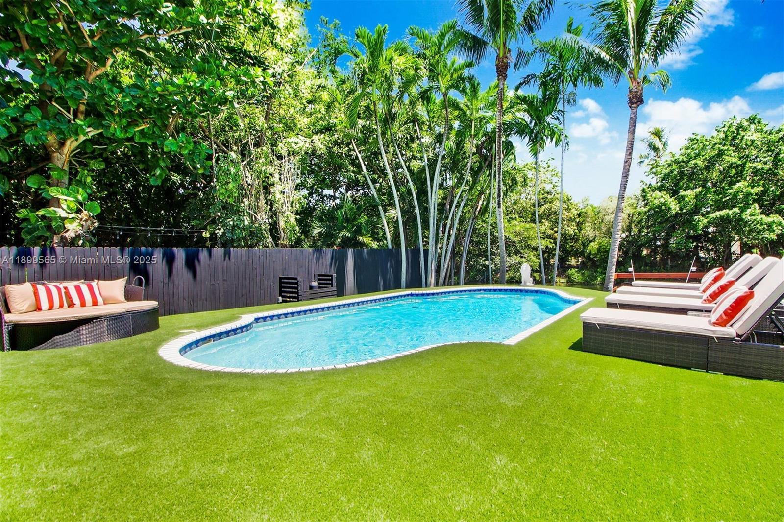 11975 West Biscayne Canal Road Miami, FL 33161 - Photo 13 of 58 a view of a swimming pool with a patio