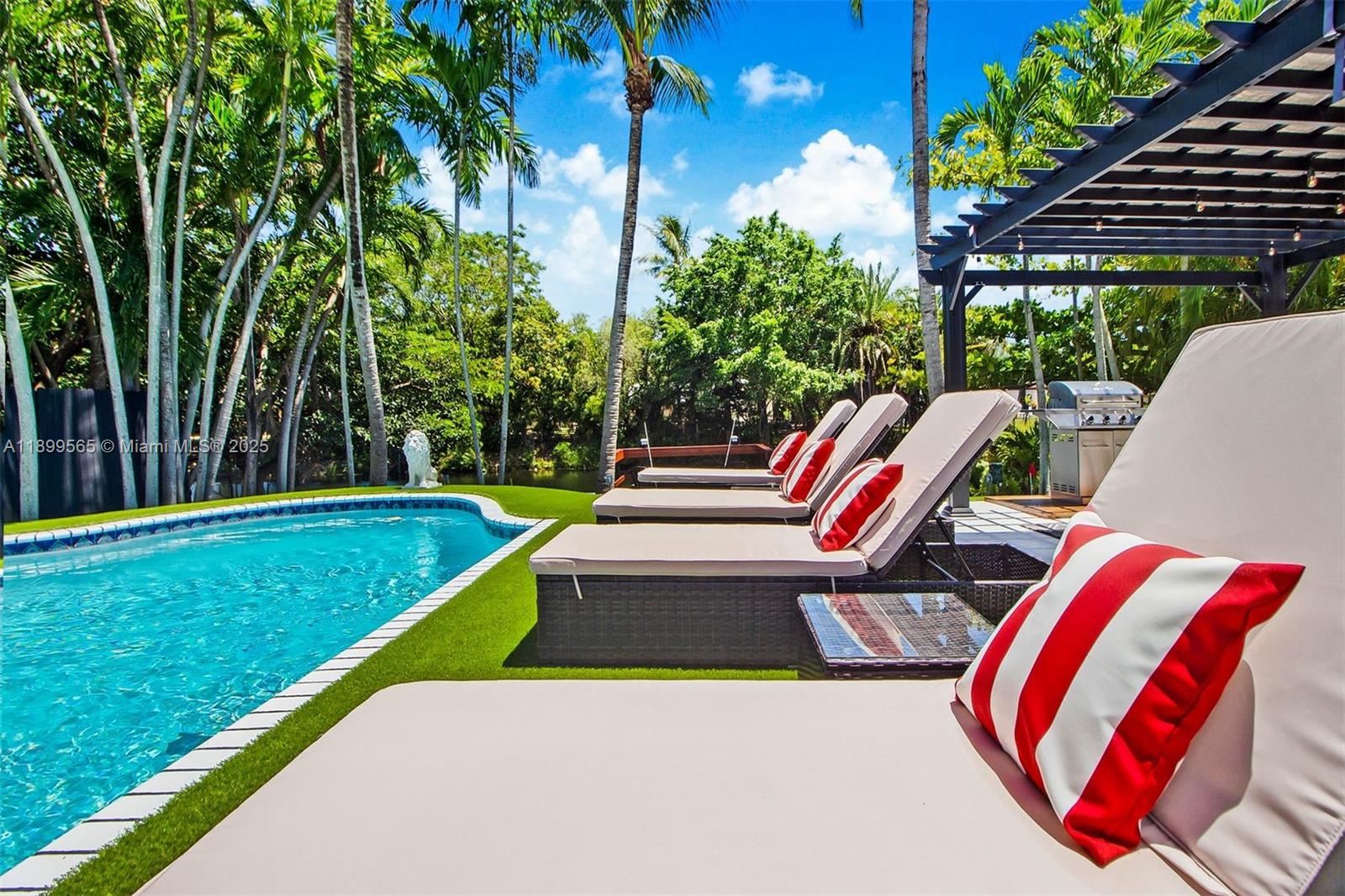 11975 West Biscayne Canal Road Miami, FL 33161 - Photo 14 of 58 a view of swimming pool with lounge chair