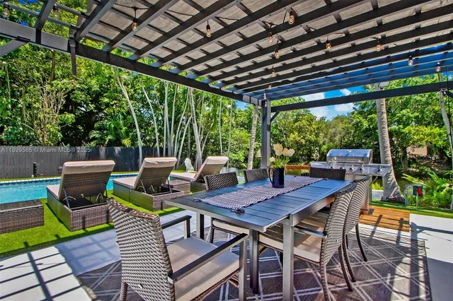 a view of a park with iron fence