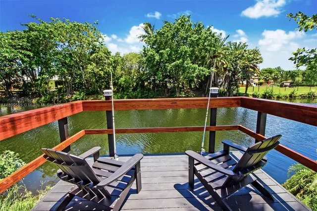 a kitchen with stainless steel appliances granite countertop a sink counter space and cabinets