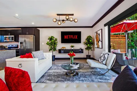 a bedroom with a large bed and a large window