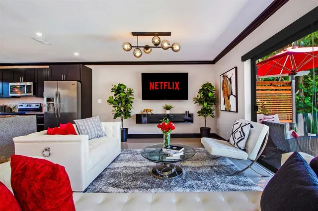 a bedroom with a large bed and a large window