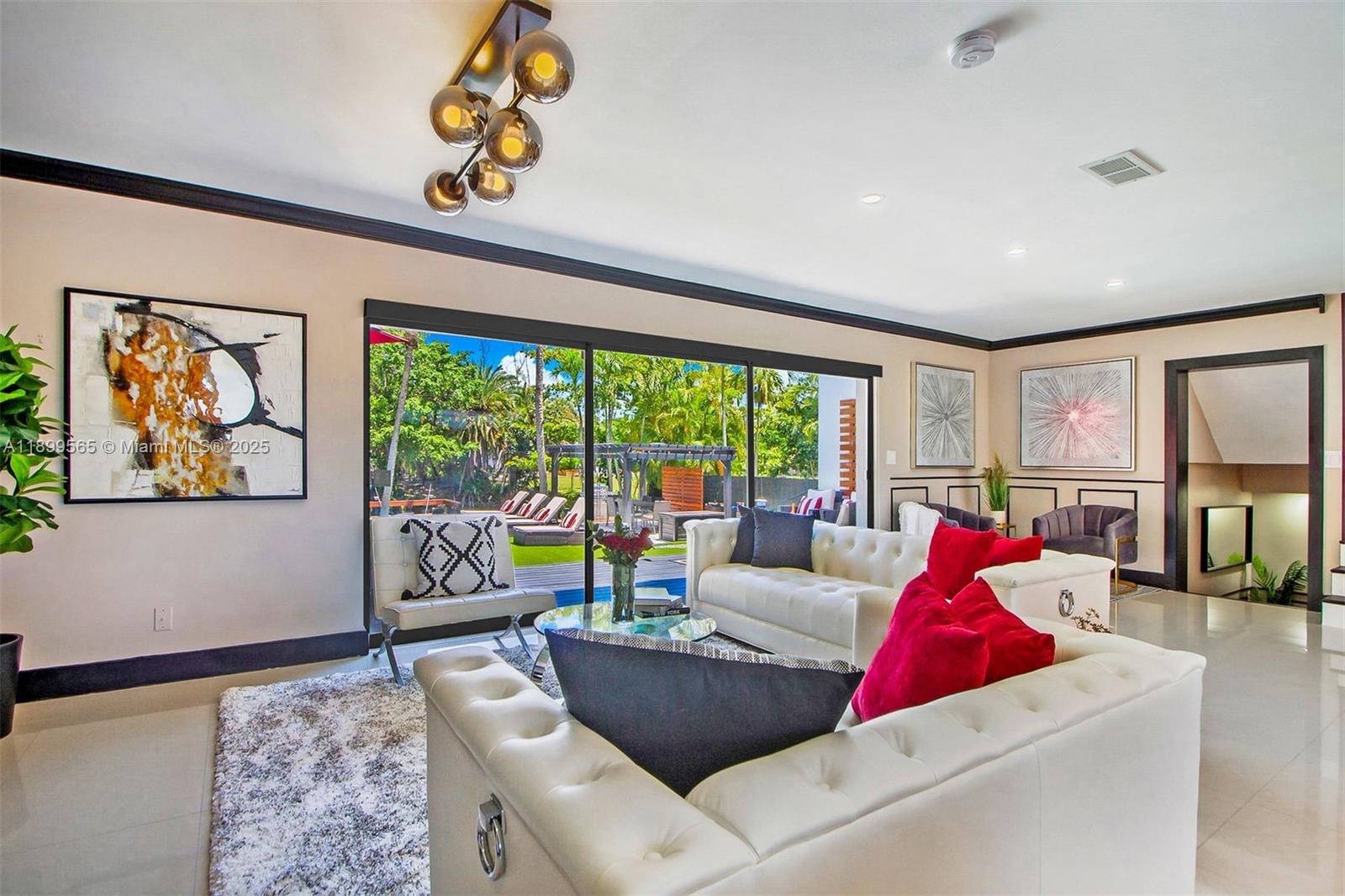 11975 West Biscayne Canal Road Miami, FL 33161 - Photo 36 of 58 a living room with furniture and a large window