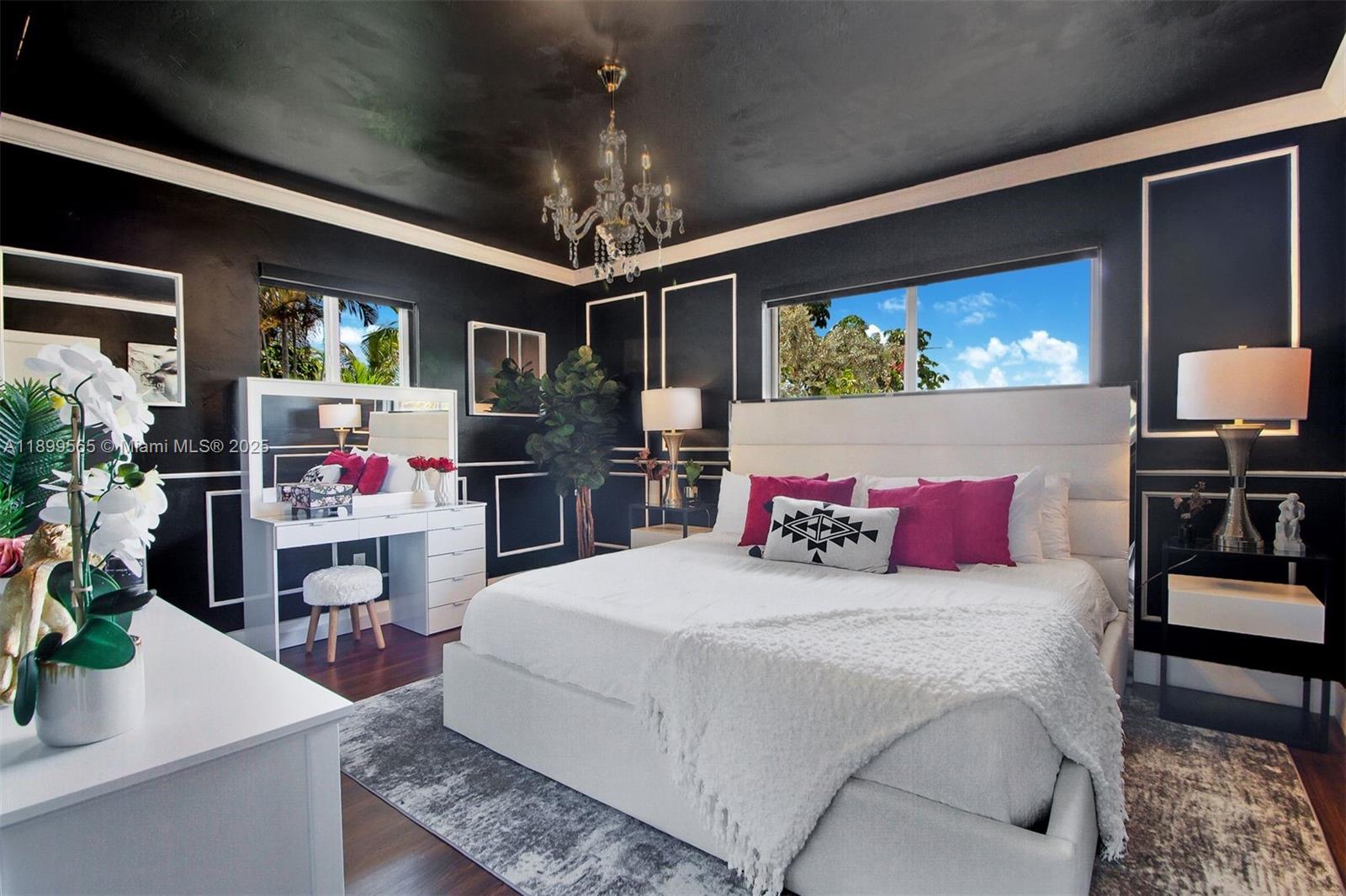 11975 West Biscayne Canal Road Miami, FL 33161 - Photo 53 of 58 a bedroom with a bed and a flat screen tv