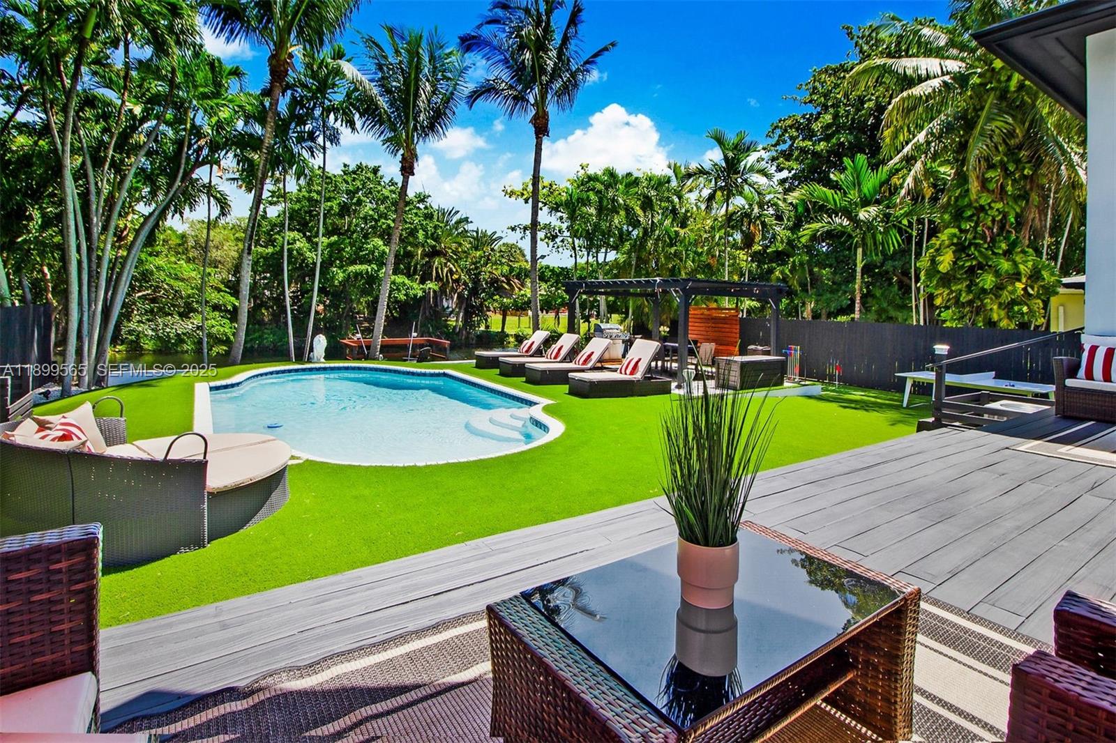 11975 West Biscayne Canal Road Miami, FL 33161 - Photo 6 of 58 a view of a backyard with sitting area