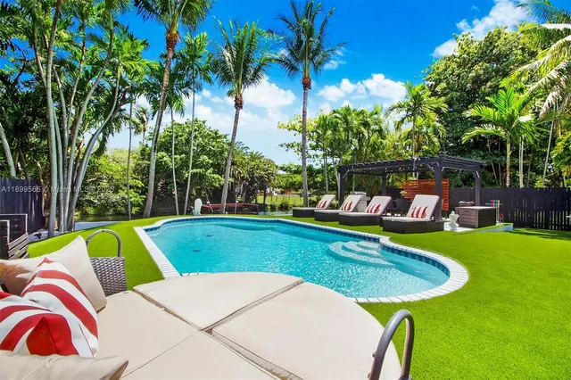 a view of a swimming pool with a patio