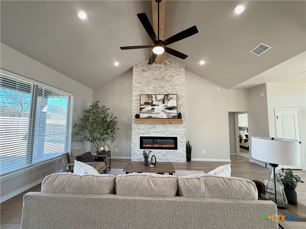 203 Lasso Loop Lorena, TX 76655 - Photo 14 of 36 a living room with furniture and a fireplace