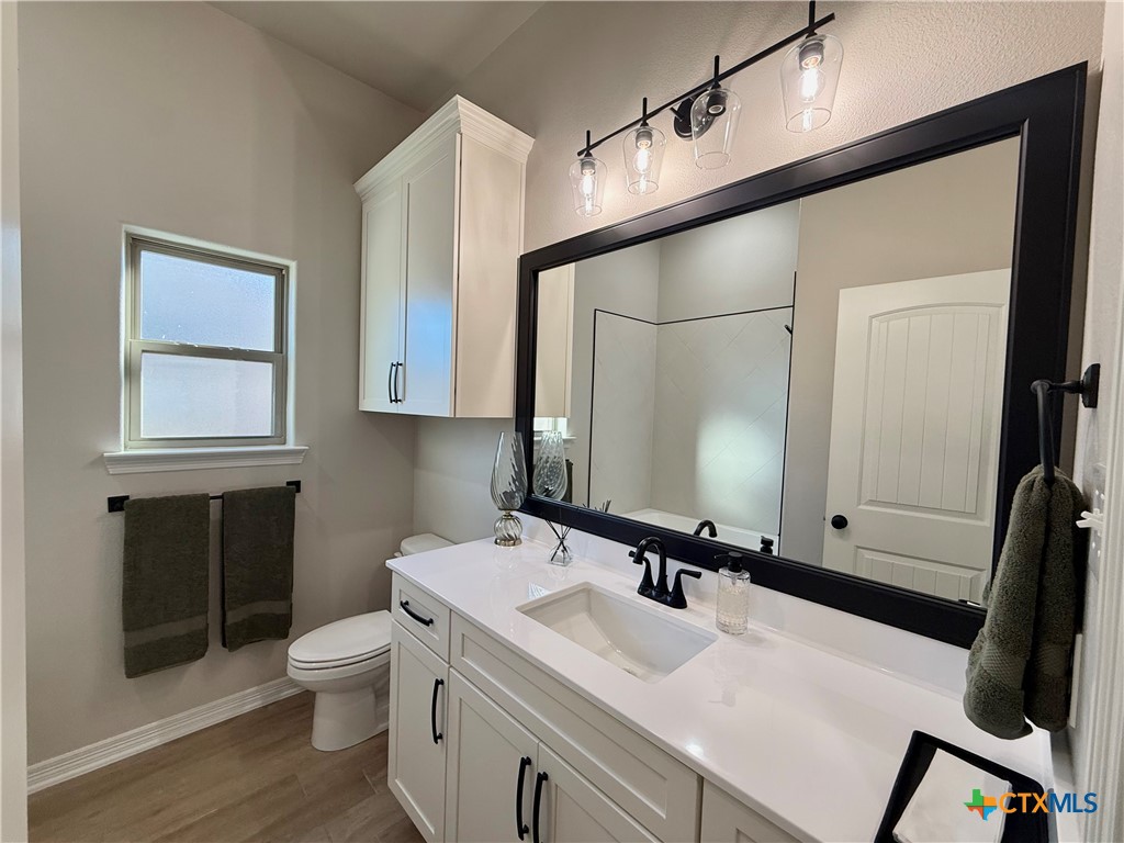 203 Lasso Loop Lorena, TX 76655 - Photo 17 of 36 a bathroom with a sink and a mirror