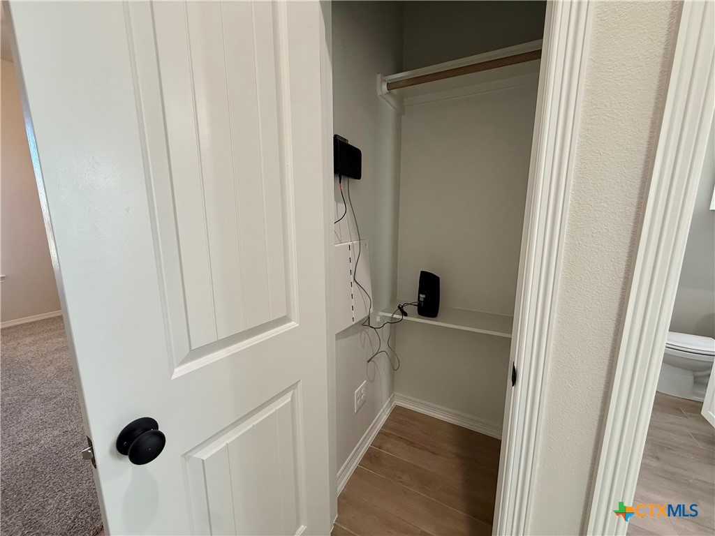 203 Lasso Loop Lorena, TX 76655 - Photo 19 of 36 a bathroom with a tub and mirror