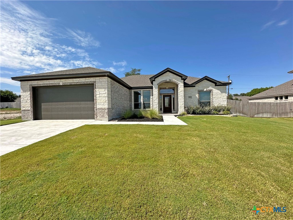 203 Lasso Loop Lorena, TX 76655 - Photo 21 of 24 a front view of a house with a yard