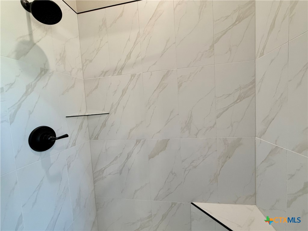 203 Lasso Loop Lorena, TX 76655 - Photo 27 of 36 a bathroom with a shower
