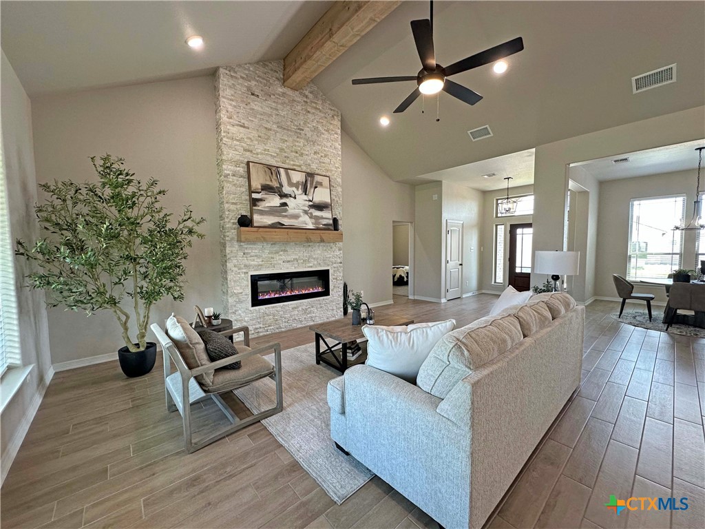 203 Lasso Loop Lorena, TX 76655 - Photo 3 of 24 a living room with furniture and a fireplace