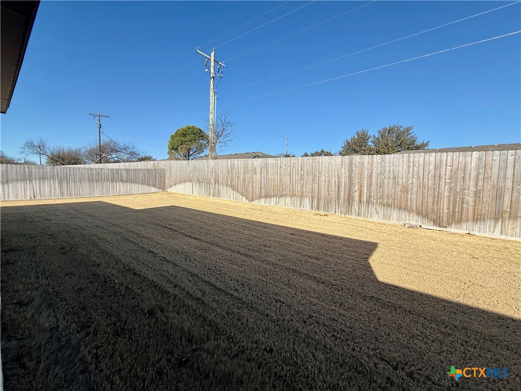 203 Lasso Loop Lorena, TX 76655 - Photo 35 of 36 a view of a swimming pool with a yard