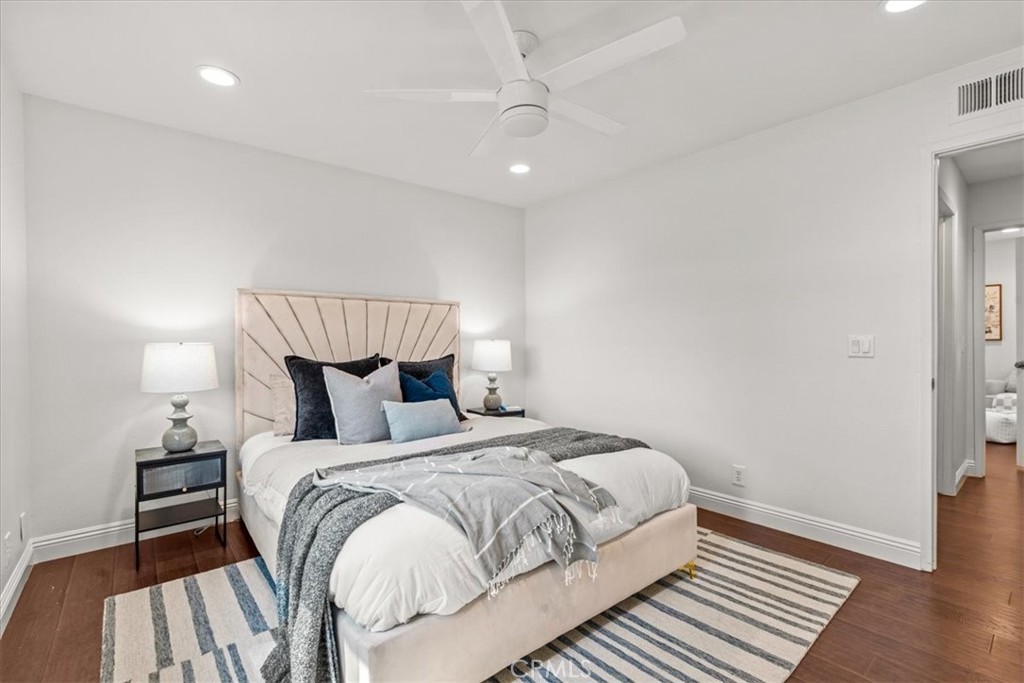 3 Christamon South Irvine, CA 92620 - Photo 21 of 40 a bedroom with a bed and wooden floor