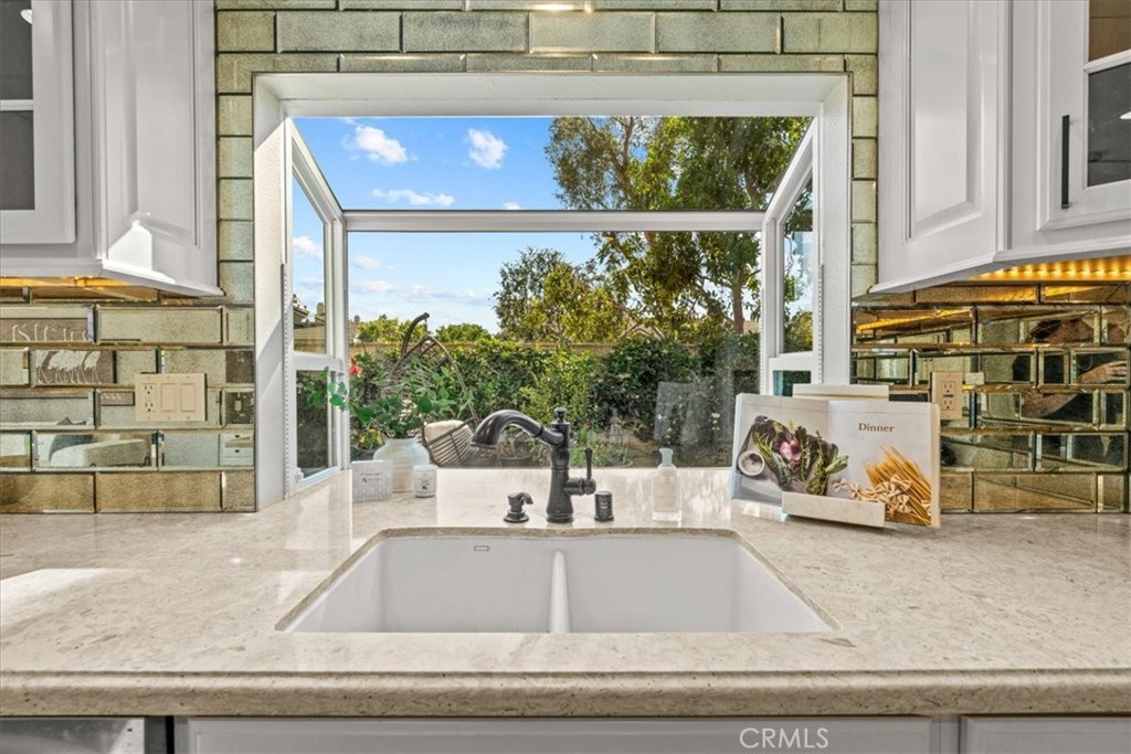 3 Christamon South Irvine, CA 92620 - Photo 6 of 40 a view of a living room with a floor to ceiling window and potted plant