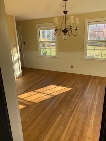 407 High Plain Road Andover, MA 01810 - Photo 14 of 25 a view of empty room with wooden floor and fan