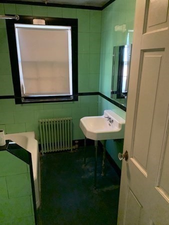 407 High Plain Road Andover, MA 01810 - Photo 18 of 25 a bathroom with a sink a mirror and a toilet