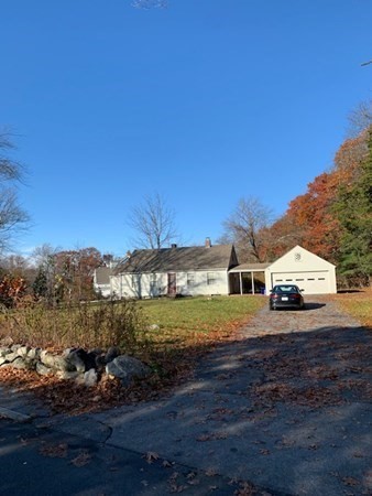 407 High Plain Road Andover, MA 01810 - Photo 2 of 25 a view of a big house with a big yard and large trees