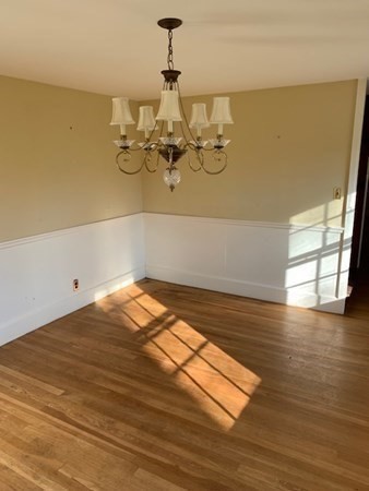 407 High Plain Road Andover, MA 01810 - Photo 24 of 25 a view of a room with wooden floor and lounge chair