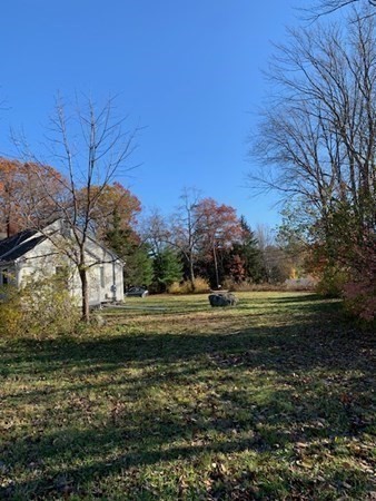 407 High Plain Road Andover, MA 01810 - Photo 4 of 25 a backyard of a house with lots of green space
