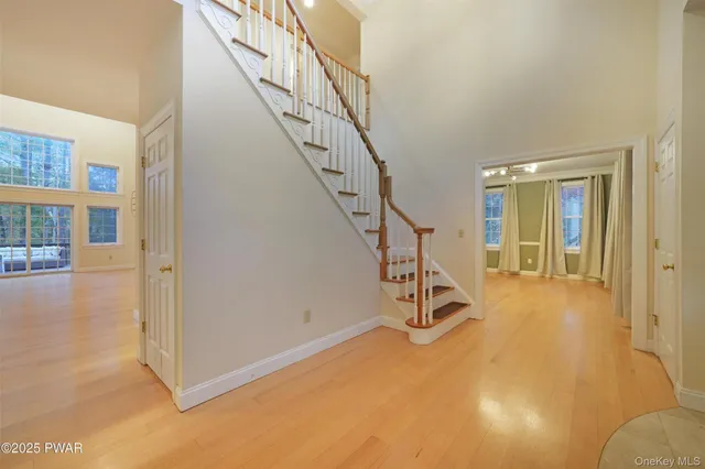 a view of a livingroom with stairs and furniture
