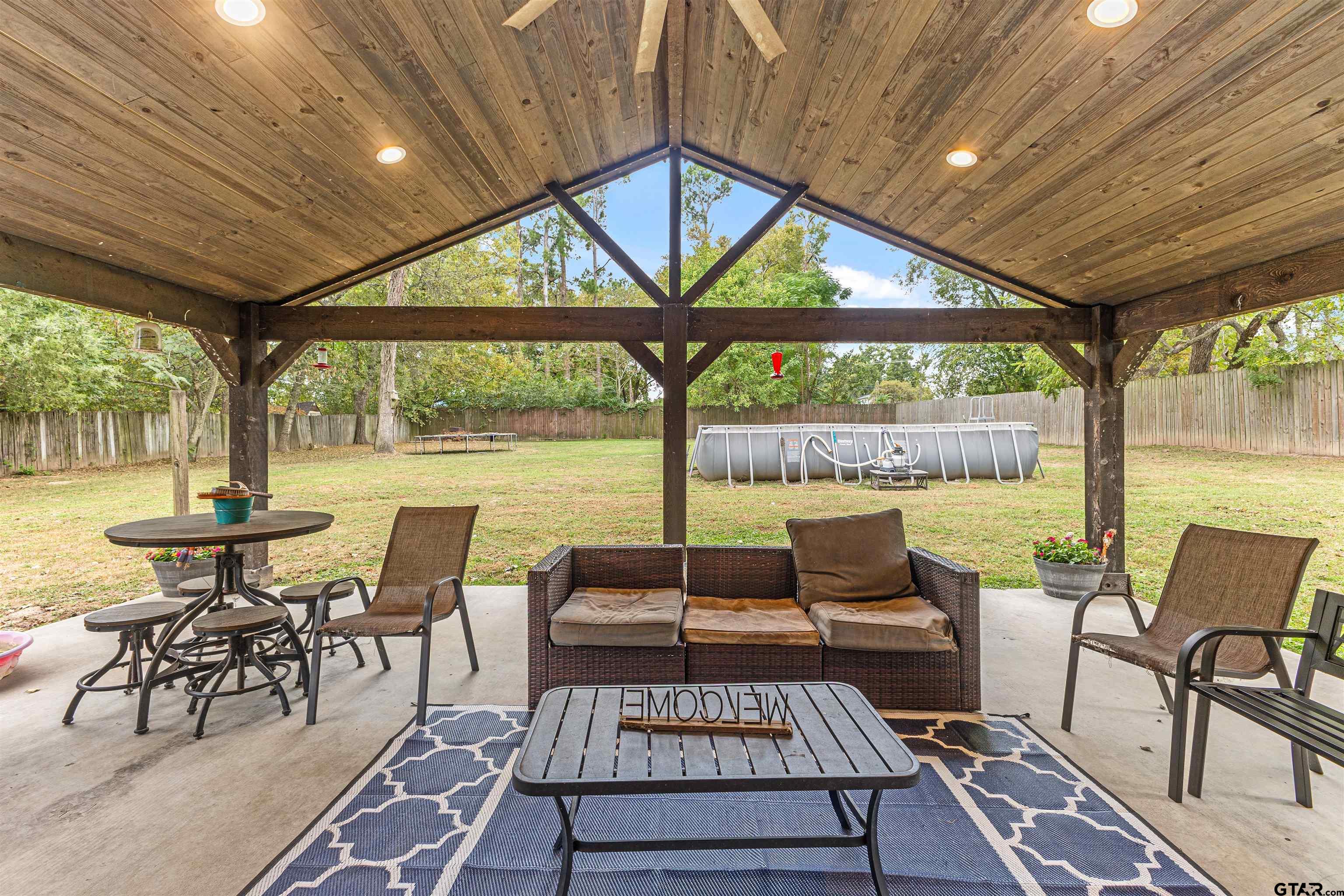 106 Pecan Ridge Mount Vernon, TX 75457 - Photo 26 of 31 a view of a patio with a table chairs and a patio