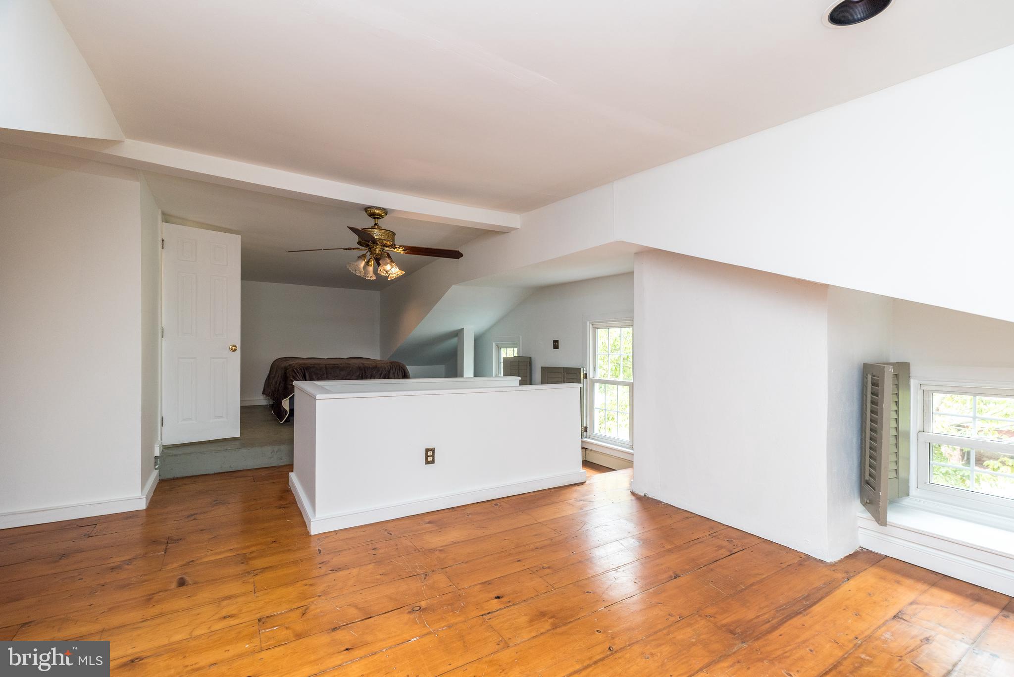 1341 Durham Road New Hope, PA 18938 - Photo 57 of 75 a view of a livingroom with wooden floor and a ceiling fan