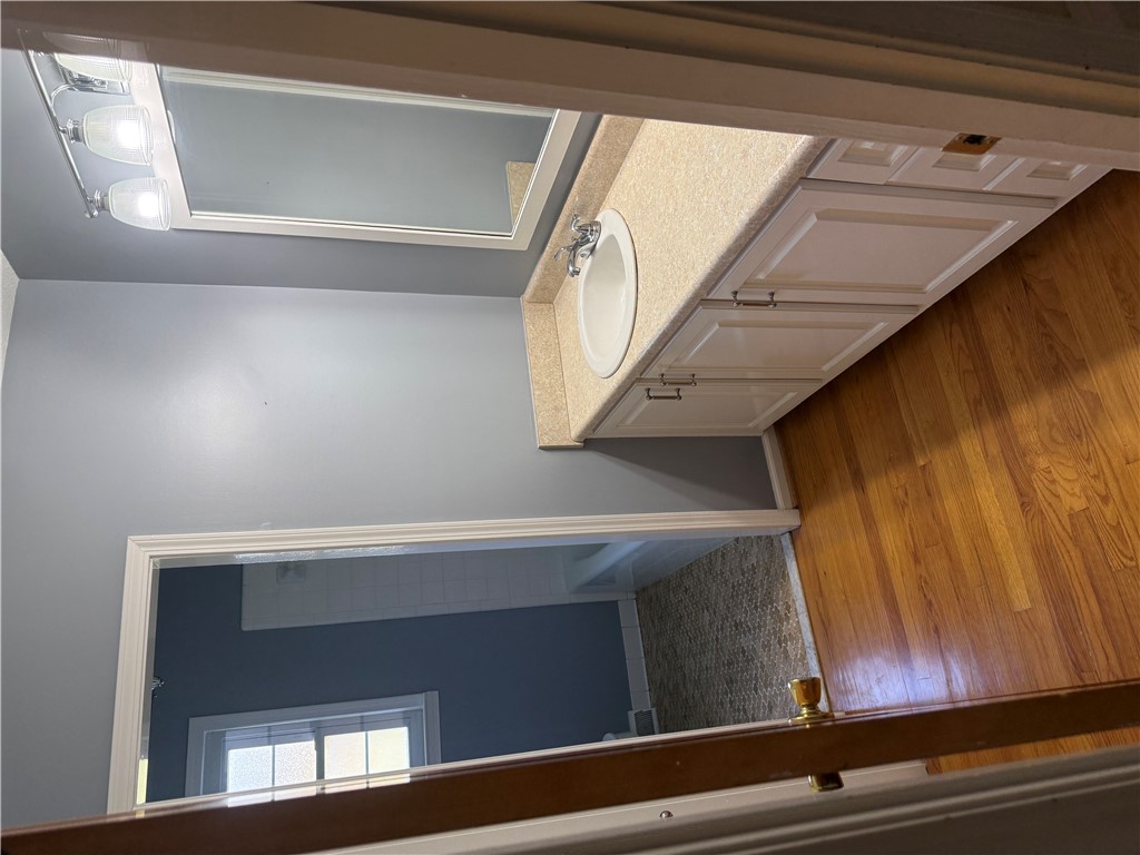 121 Nautical Way Anderson, SC 29625 - Photo 25 of 37 A well-lit vanity with a mirror and spacious cabinetry anchors this refreshing bathroom.
