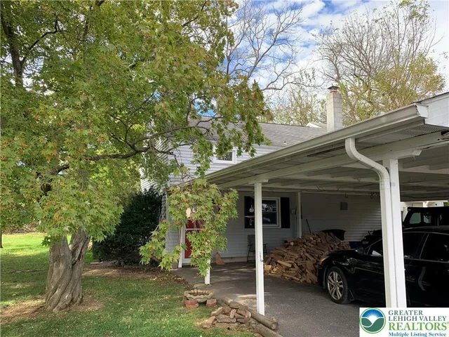 a view of house with backyard space and garden