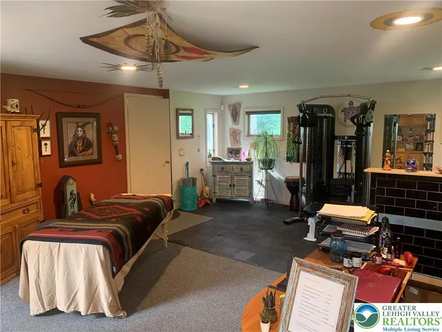 a bedroom with furniture and wooden floor