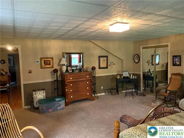 a bed room with furniture and a window