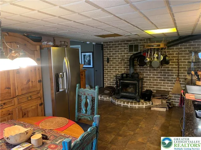 a bathroom with sink mirror and shower
