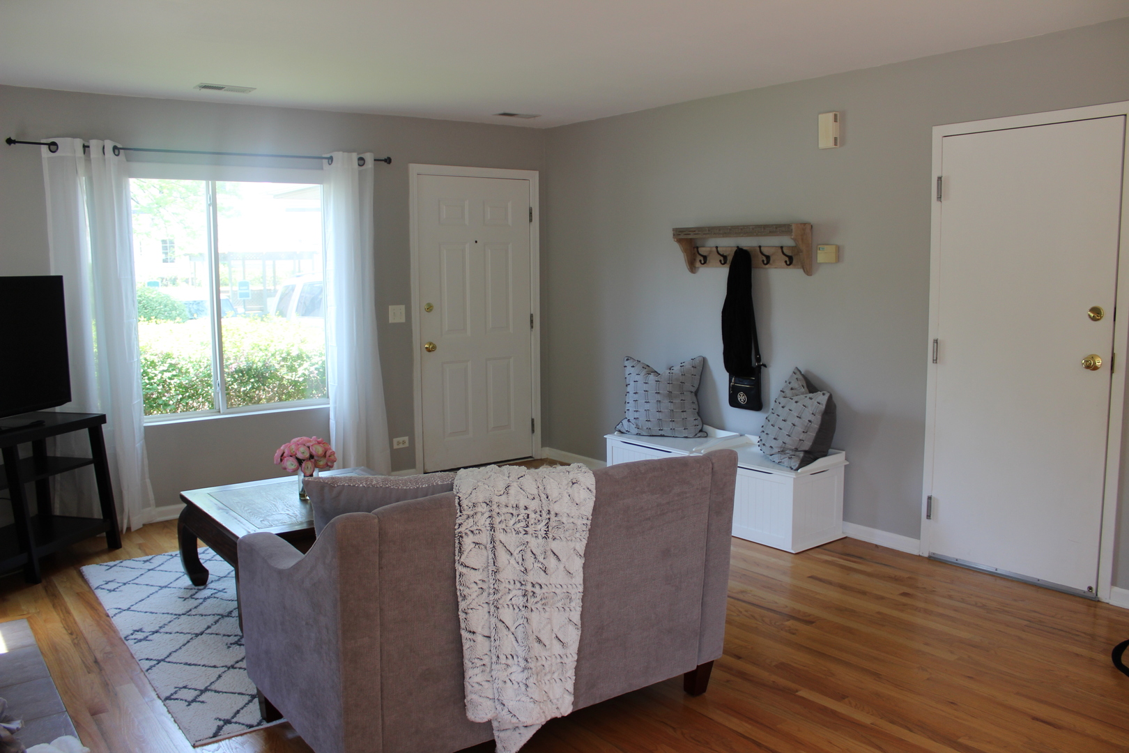 481 River Bend Road, Unit 107 Naperville, IL 60540 - Photo 14 of 17 a living room with furniture window and wooden floor