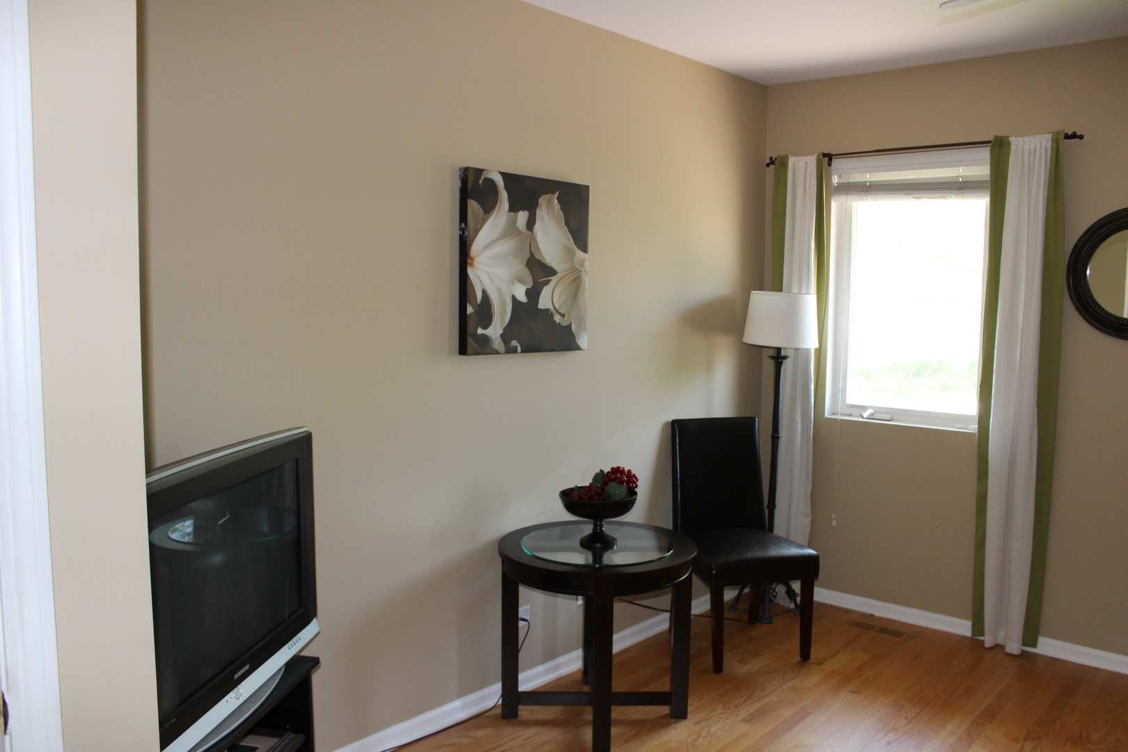 481 River Bend Road, Unit 107 Naperville, IL 60540 - Photo 15 of 17 a view of a workspace room with wooden floor and black cabinet