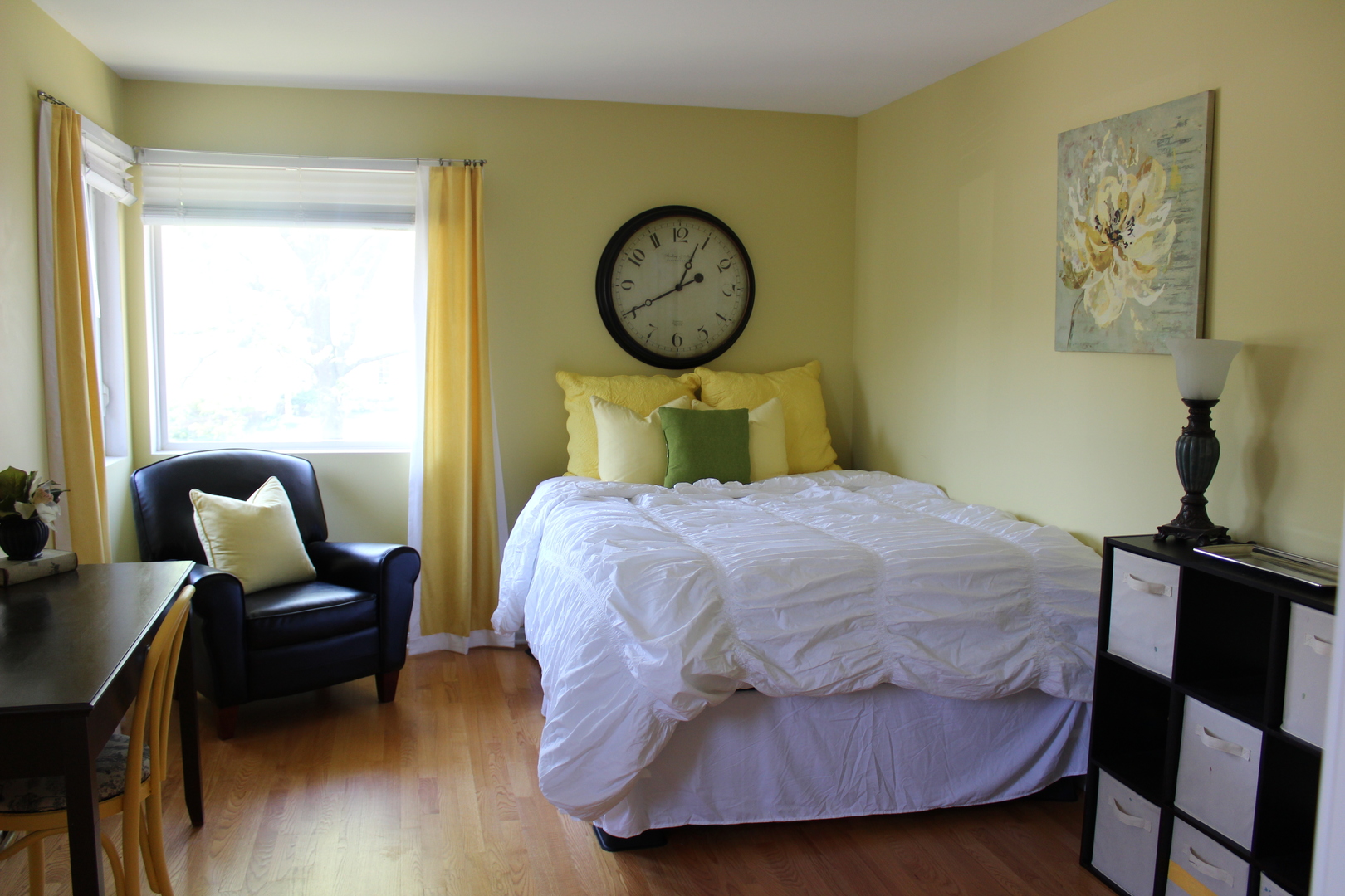 481 River Bend Road, Unit 107 Naperville, IL 60540 - Photo 5 of 17 a bedroom with a bed and wooden floor