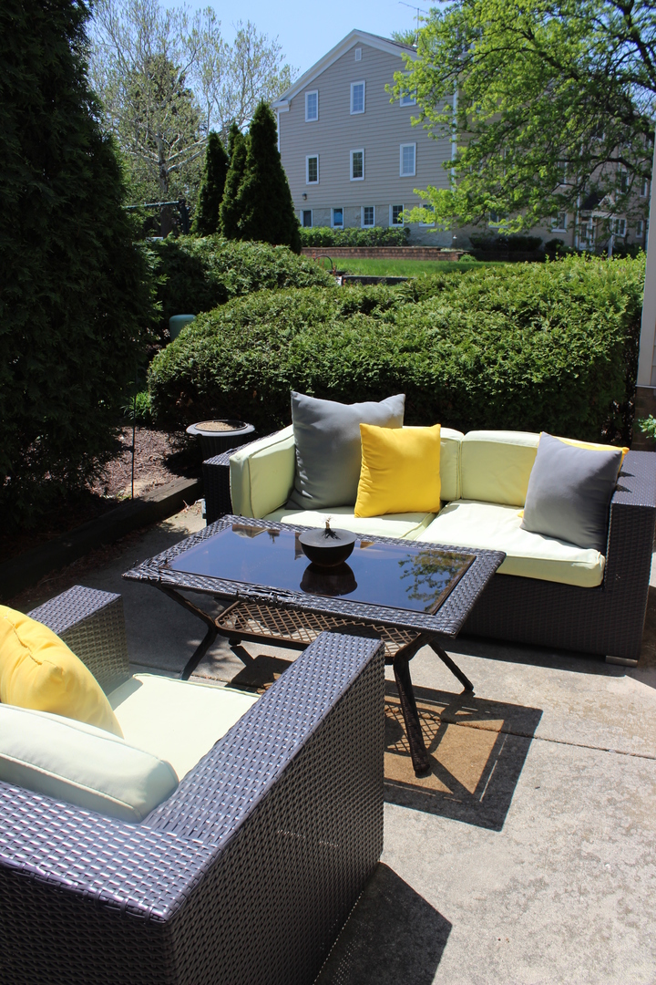 481 River Bend Road, Unit 107 Naperville, IL 60540 - Photo 6 of 17 a view of a outdoor sitting area with furniture and garden