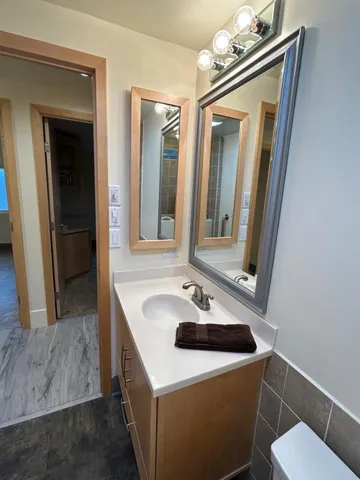 a view of an empty room with a ceiling fan