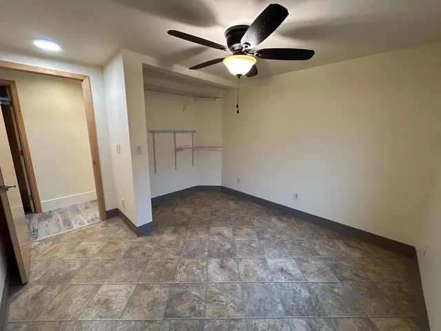 a view of a livingroom with furniture and staircase