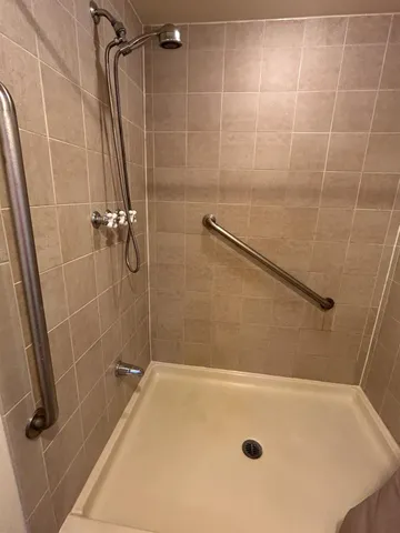 a room with granite countertop a sink and a stove
