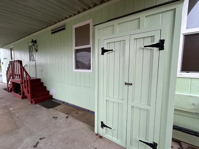 a view of a hallway with entryway door