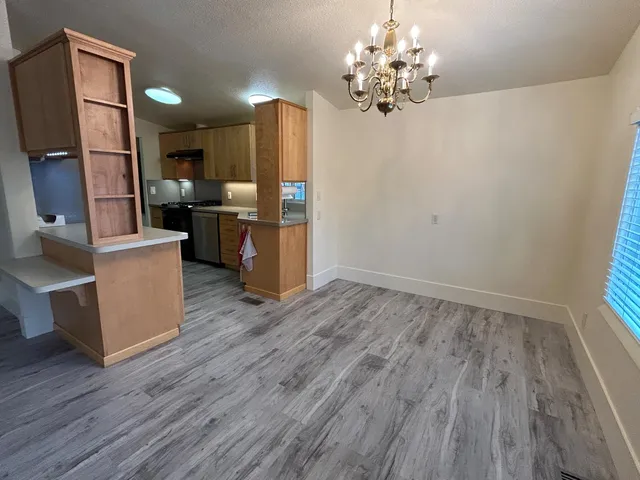 a view of kitchen and dining room with wooden floor