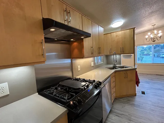 a kitchen with a stove and a refrigerator