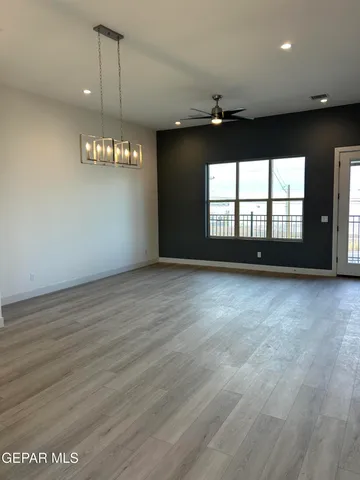 an empty room with a empty space and windows