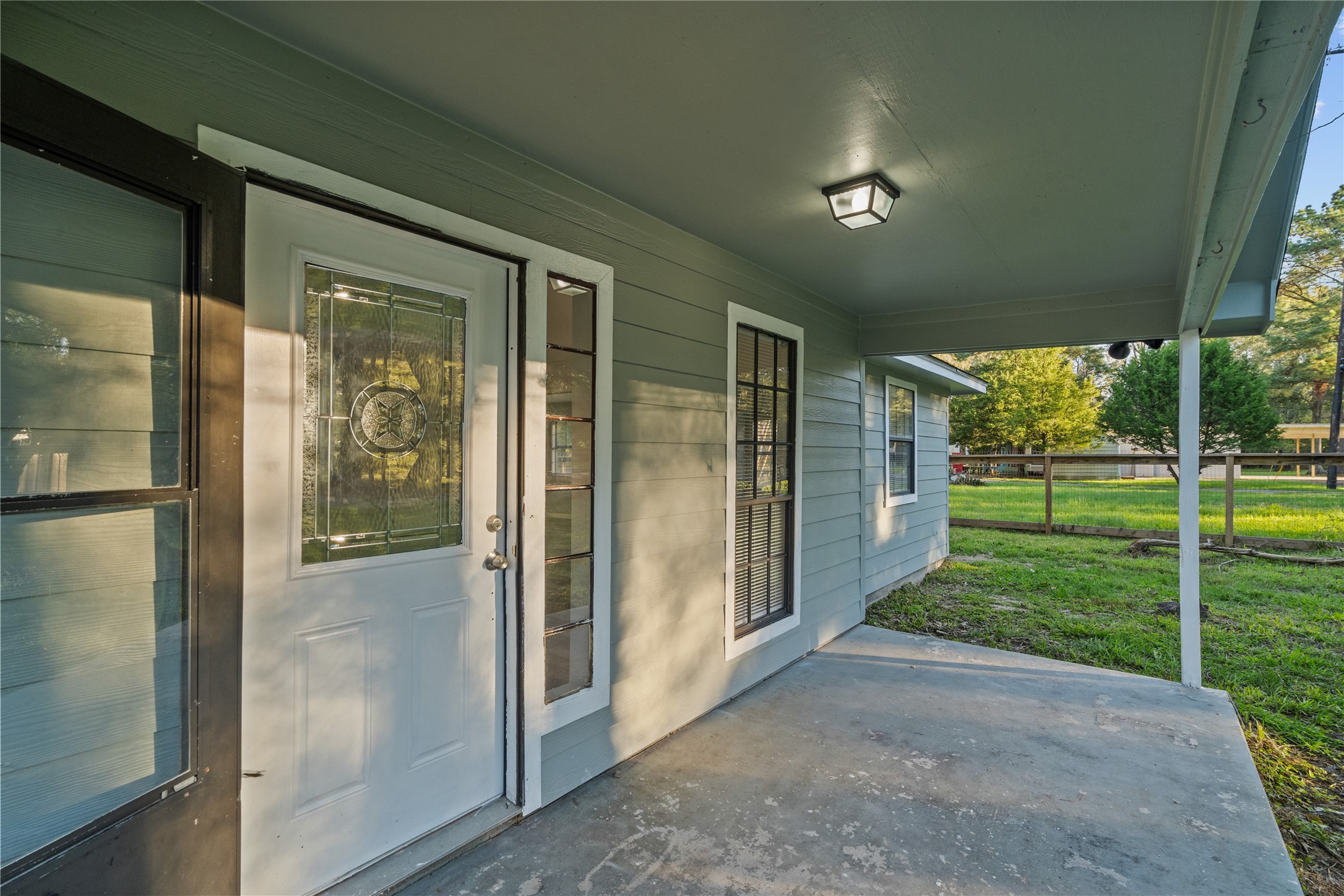 20575 Kings Road New Caney, TX 77357 - Photo 1 of 19 Welcome home! Plenty of room for outdoor potted plants and patio furniture.